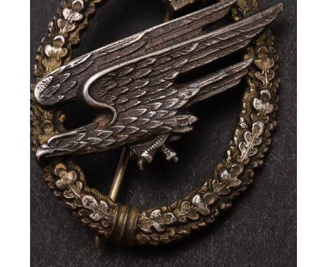 A SECOND WORLD WAR GERMAN ARMY PARATROOPERS BADGE. An Army Paratroopers Badge, Brandenburg variant, two part construction wit