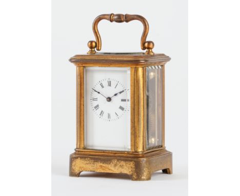 A MINIATURE FRENCH BRASS CARRIAGE TIMEPIECEIn a Corniche case, with original silvered platform escapement, movement no. 398cm