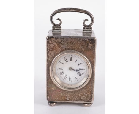 A LATE VICTORIAN SILVER CASED CARRIAGE CLOCKFitted with a French keyless wind movement, the rectangular case with a foldover 