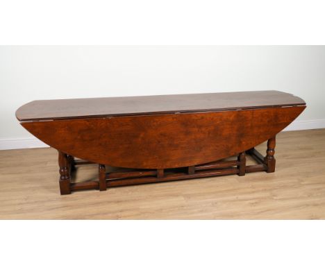 A LARGE 17TH CENTURY STYLE OAK DOUBLE GATE LEG DROP FLAP TABLE65cm wide; 172cm wide open; 290cm longCondition report:&nbsp;A 