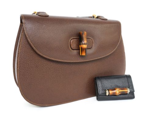 GUCCI: A LEATHER 'BAMBOO' HANDBAG AND MATCHING KEY PURSE (3)ModernIn dark brown leather, with classic 'bamboo' loop top handl