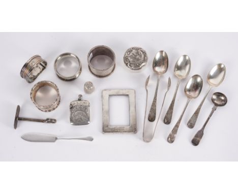 A GROUP OF SILVER AND SILVER MOUNTED WARES (16)Comprising; a vesta case, a thimble, four napkin rings, a butter knife, a salt