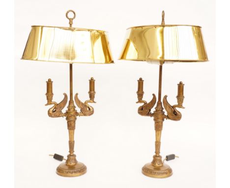 A PAIR OF EMPIRE STYLE GILT-METAL TWIN-LIGHT TABLE LAMPS (2)Late 20th Century Modelled with winged swans’ heads, 74cm high