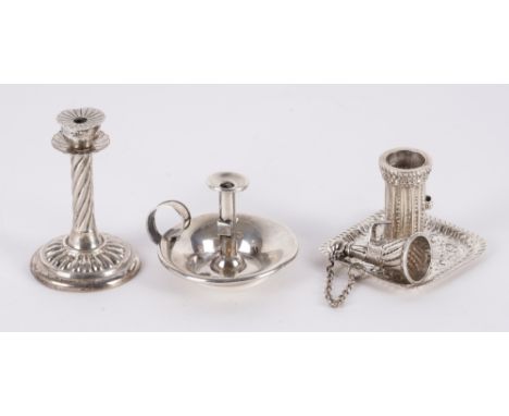 TWO MINIATURE CHAMBER STICKS AND A MINIATURE CANDLESTICK (3)Comprising; a chamberstick of square form, with floral and scroll