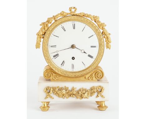 A REGENCY ORMOLU AND WHITE MARBLE MANTEL TIMEPIECECirca 1820The drum-shaped case with foliate mount, on scrolled support and 