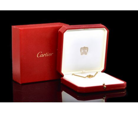 A CARTIER DIAMOND BALL NECKLACESet with a round brilliant cut diamond (estimated weight 0.20 carats), on a ball link chain, w