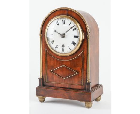 A LATE REGENCY FRUITWOOD AND BRASS-MOUNTED MANTEL TIMEPIECECirca 1820The arched case with slender brass three-quarter columns