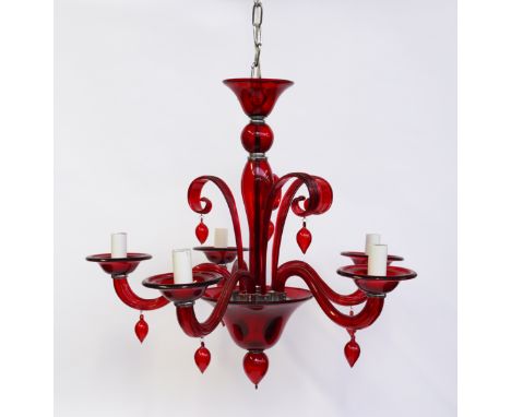 A VENETIAN RUBY RED COLOURED GLASS FOUR BRANCH CHANDELIERModernWith scrolling arms and pendant drops, 64cm wide, 55cm high
