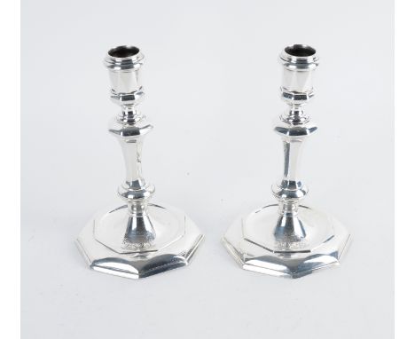 A PAIR OF GEORGE I BRITANNIA STANDARD SILVER CANDLESTICKSEach with an octagonal tapered knopped stem, raised on an octagonal 