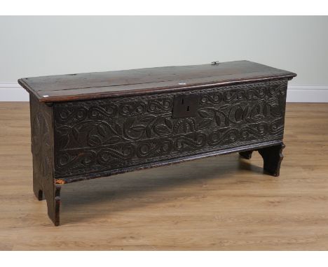 A 17TH CENTURY CARVED OAK PLANK COFFER132cm wide; 41cm deep; 57cm highPlease see the dimensions in the description.Condition 