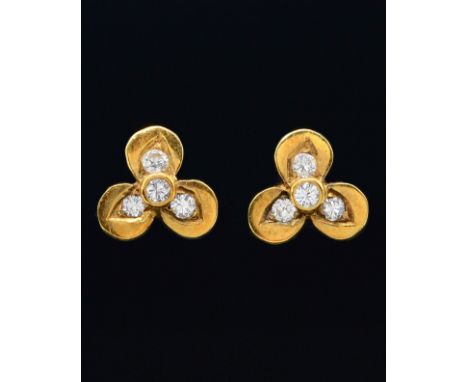 A PAIR OF DIAMOND STUD EARRINGSEach stud earring mounted with four round brilliant cut diamonds, in a trefoil design, in 18 c