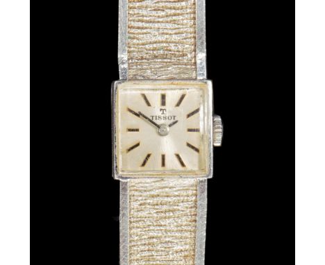 A LADY'S TISSOT 9CT WHITE GOLD MANUAL WIND BRACELET WRISTWATCHHallmarked for Birmingham 1972, the square dial with black bato