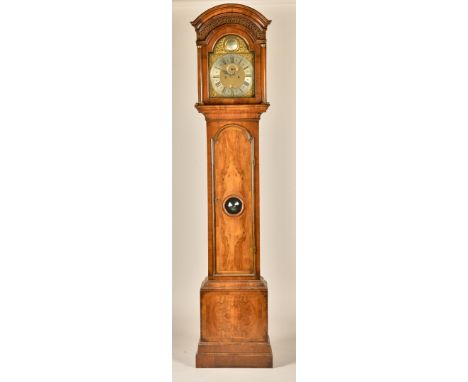 A GEORGE II  WALNUT LONGCASE CLOCKThe movement signed Robert Sadler, LondonThe arched hood with a deeply-moulded edge above f