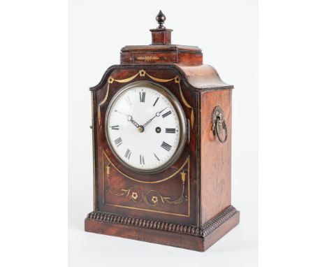 A REGENCY MAHOGANY AND BRASS-INLAID MANTEL TIMEPIECECirca 1815The case with a turned finial, above a platform and swept sides