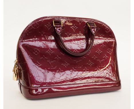 LOUIS VUITTON: VERNIS MONOGRAM LEATHER ALMA HANDBAGModernIn purple/burgundy patent leather, with gold hardware and padlock do