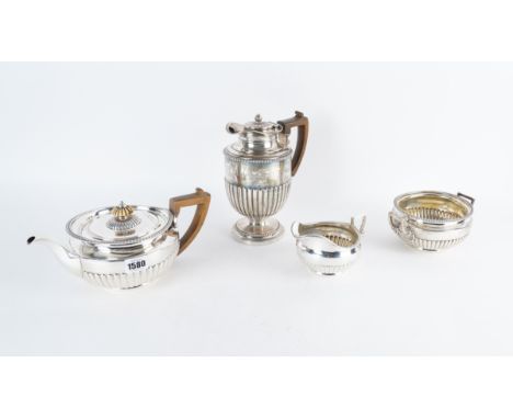 A SILVER FOUR PIECE TEA AND COFFEE SET (4)Comprising; a teapot, a coffee jug with a silver stand and plated spirit burner, a 