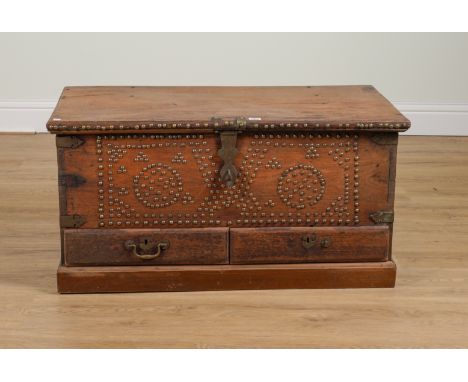 A 19TH CENTURY BRASS STUDDED TEAK TWO DRAWER ZANZIBAR TRUNK96cm wide; 46cm deep; 49cm highCondition report:&nbsp;Wear to some