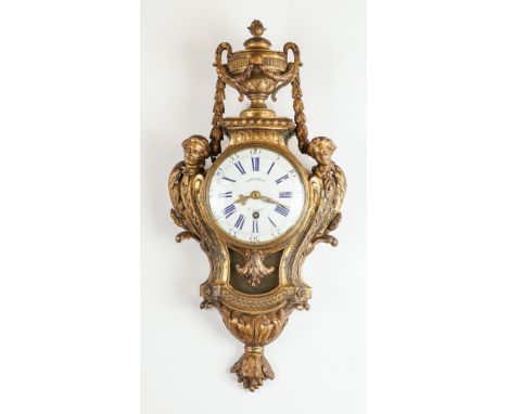 A LOUIS XVI ORMOLU CARTEL CLOCK WITH QUARTER REPEATBy Godfrey, Paris, circa 1770The substantial cast case modelled with an ur