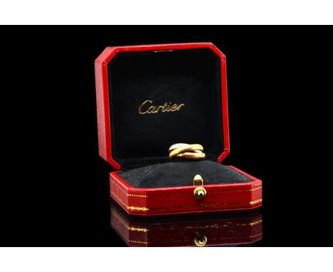 A CARTIER TRINITY RINGWith three bands of yellow, white and rose 18 ct gold, size L, weight 7.9 gms, with a Cartier box and o