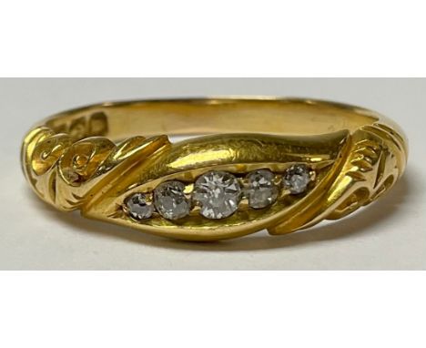 A Victorian 18ct gold five stone graduated diamond ring, size P, scroll bezel, marked 18, London 1896, 3.9g 