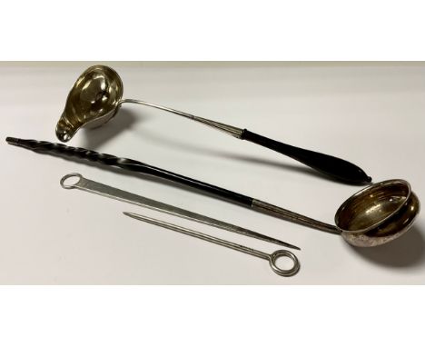A Georgian silver coloured metal toddy ladle, baleen handle, 38.5cm long; another, Continental; a 19th century silver skewer,