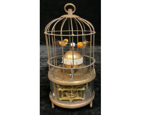 A reproduction novelty automaton clock, as a bird in a cage, approx. 18cm high over loop 