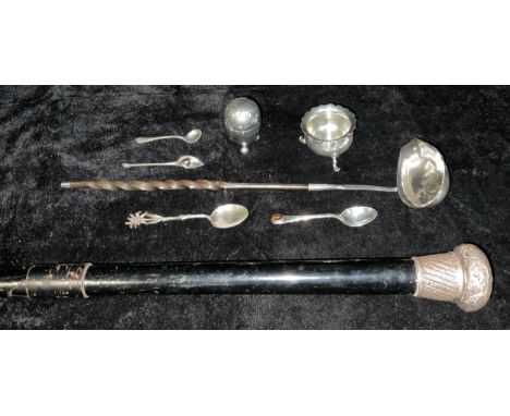 A Georgian silver toddy ladle, set with a George I coin 1723, twisted baleen handle, unmarked; a late 19th century ebonised w