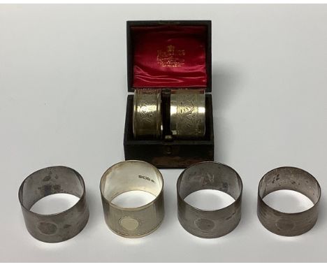 An Edward VII silver napkin ring, Chester 1908, boxed; five other silver napkin rings, 157g (6) 