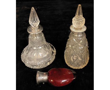A George V silver mounted cut glass scent bottle, prismatic drop in stopper, 16cm, Birmingham 1924; another similar, marked s