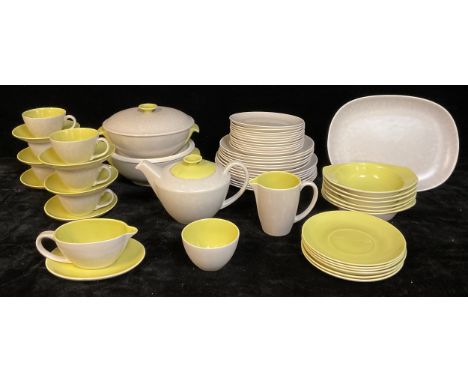 A Poole twintone lime yellow and seagull grey dinner and tea service, pattern number C103, including teapot, milk and sugar, 