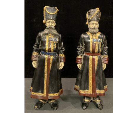 A pair of Russian cold painted 'bronze' metal figures as Cossacks, each approximately 40cm high (2) 