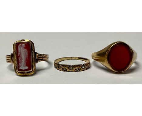 A 9ct gold signet ring, set with a single carnelian, size S, 3.8g; an unmarked gold cameo ring, size O, 2.8g; a 9ct gold ring