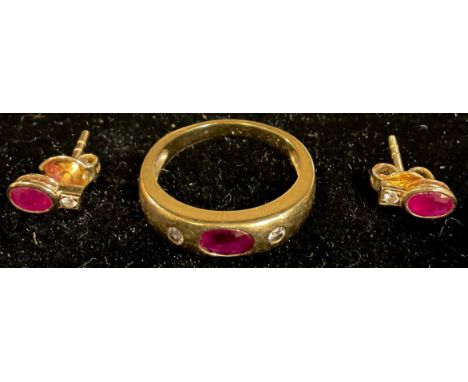 An 18k gold ruby and diamond three stone ring, size N/O, apparently unmarked, 4.3g, with certificate from Jaipur; a conformin