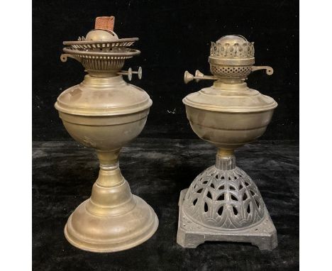An early 20th century brass oil lamp; another, with cast iron base (2)