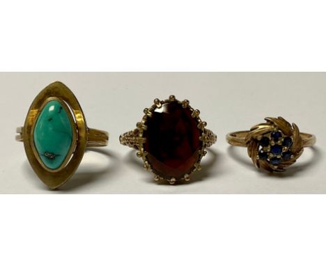 A 9ct gold dress ring, set with a polished lozenge shaped turquoise stone, size Q/R, marked 375, 4g; a 9ct gold ring, set wit