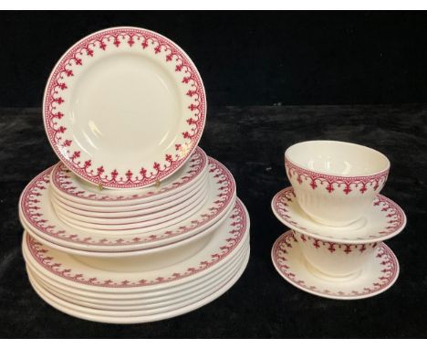 A Minton part dinner service transfer printed with a gothic trellis design after Pugin, in wine red, comprising six dinner pl