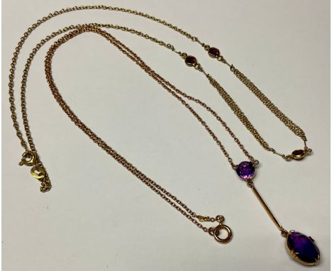An Edwardian 9ct rose gold pendant droplet necklace, set with two faceted amethyst stones, 25cm drop, marked 9ct, 3g; an 18ct