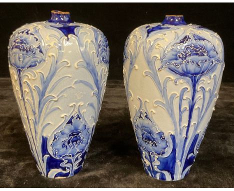 A pair of James Macintyre Florian Ware ovoid vases, tube lined with poppies and scrolls in tones of blue, 19cm high, printed 
