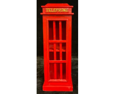 A small wooden cabinet, as a telephone box, painted in red, with hinged magnetic door, 52cm high 