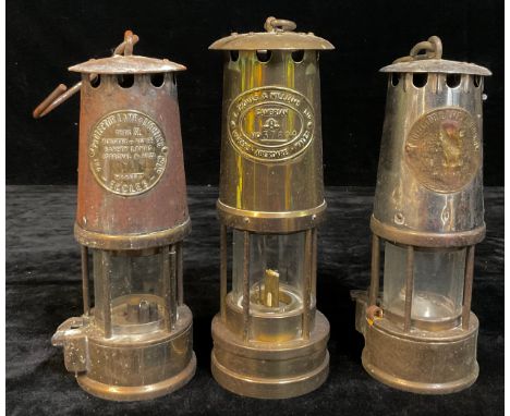 An Eccles miner's safety lamp, Type SL; another, Type 6; a Thomas &amp; Williams, Cambrian miner's safety lamp (3) 