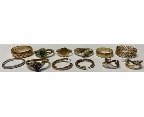 A 9ct gold wedding band, size J, 2.2g; other 9ct gold rings, some set with stones; two pairs of 9ct gold earrings; a platinum