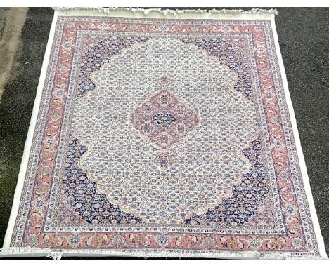 A large Persian style carpet in cream blue &amp; pink 324 cm by 239.5 cm 