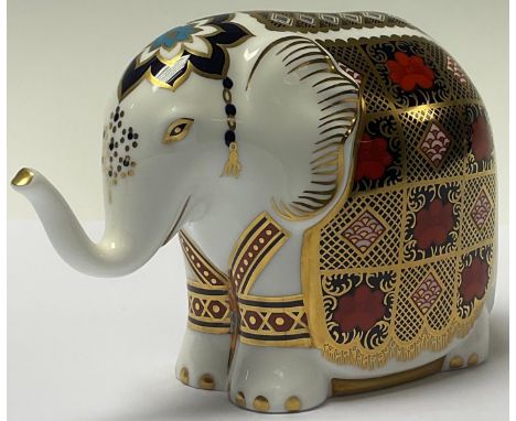 A Royal Crown Derby paperweight, Imari Elephant, trunk raised, gold stopper, boxed 