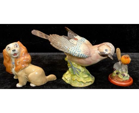 A Beswick model of a Jay, number 1219, 24cm wide, printed and impressed marks, original paper label; a Wade model of a Disney