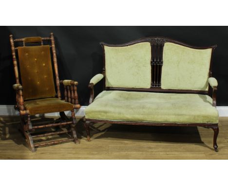 An early 20th century American design spring rocking chair, 97cm high, 58cm wide, the seat 41cm wide and 43cm deep; an early 