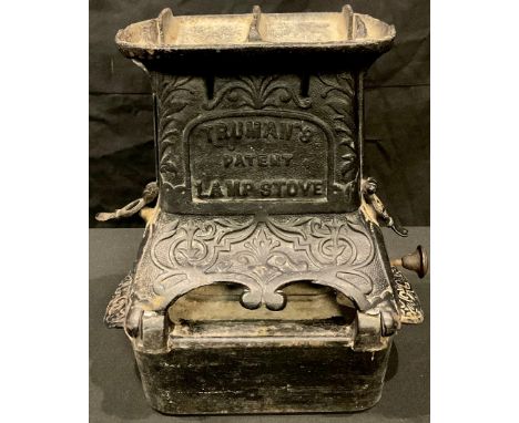 A cast iron Truman's Lamp Stove, integral burner, 28cm high 