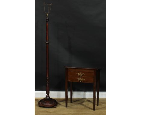 An early 20th century mahogany slope top reading table, 68.5cm high, 56cm wide, 35cm deep; a shell base floor lamp, 149cm hig