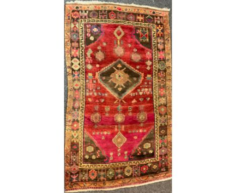 A Middle Eastern Hamadan carpet, 86" x 53"