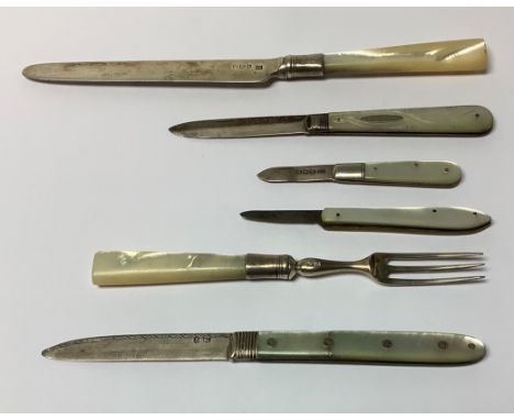 A Victorian silver and mother-of-pear fruit knife, 13.5cm open, London 1875; three others similar; a William IV silver and mo