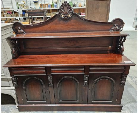 Reproduction Victorian-style mahogany sideboard&nbsp;having single shelf to the top with carved finials, raised over three sh